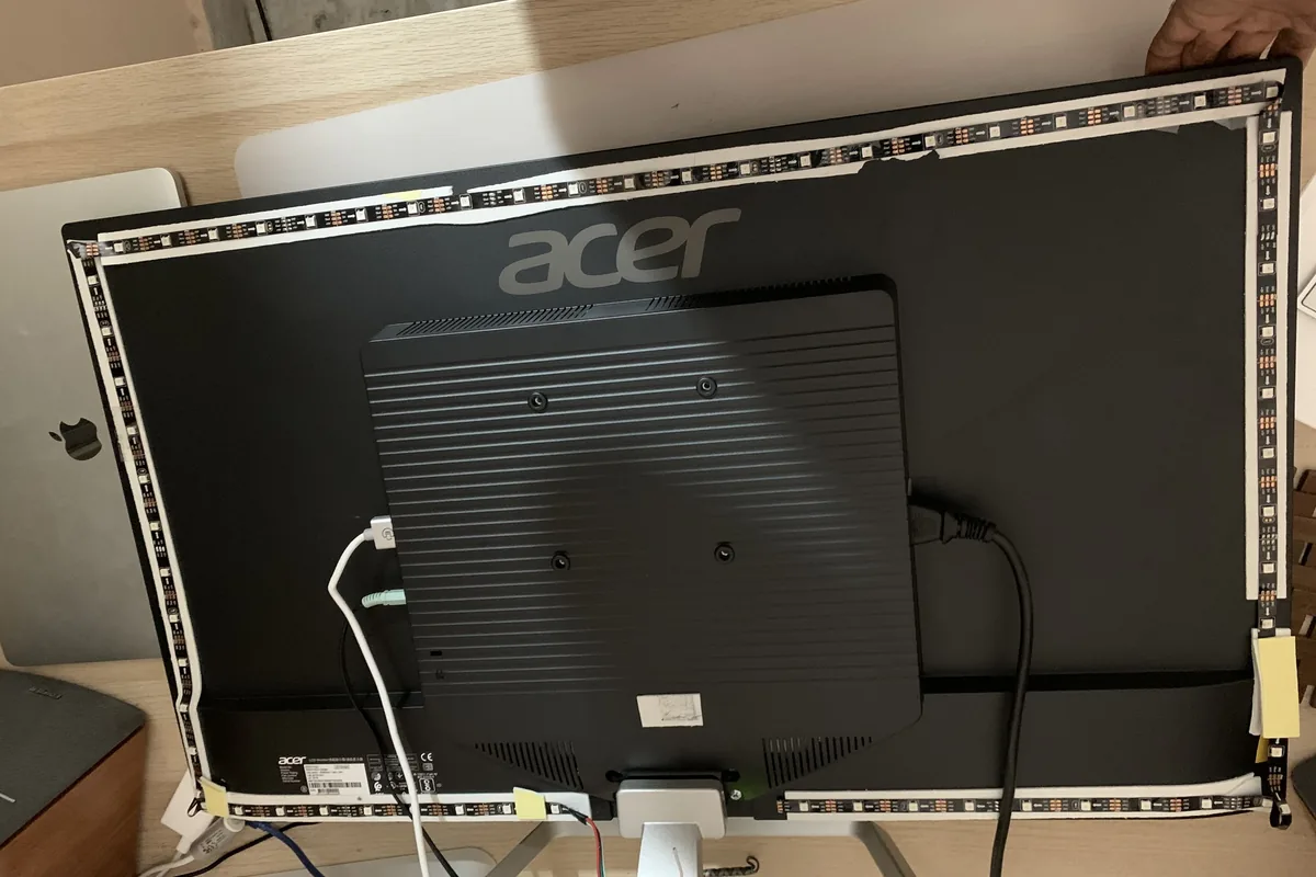 LED strips fitted around the back of a monitor for a DIY Ambilight